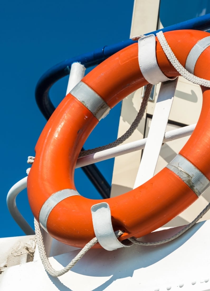 Orange life buoy on a boat
