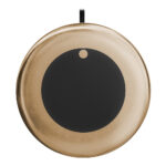 Gold and black wireless charging pad.