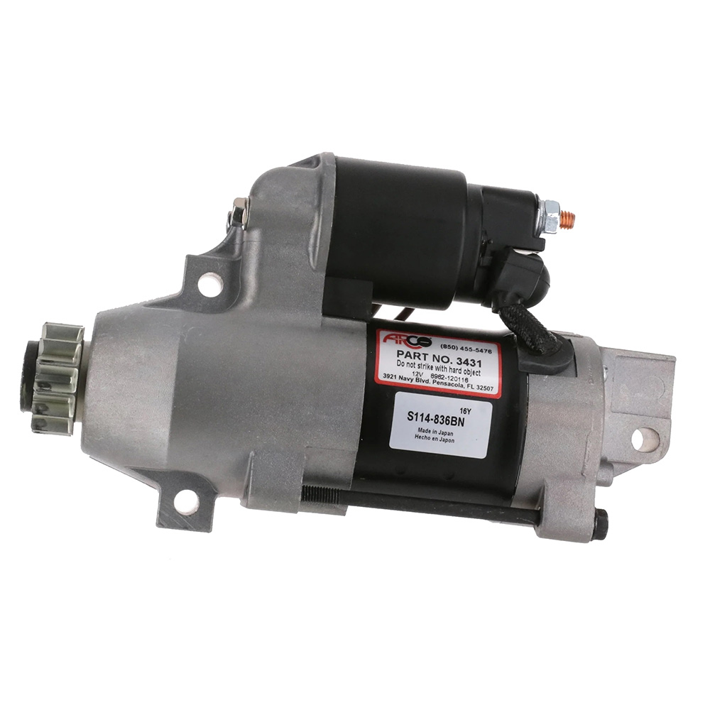 Automotive starter motor with label and part number.