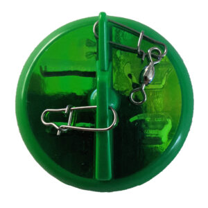 Green round disc with metal clips.