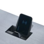Black wireless charger in a desk mount