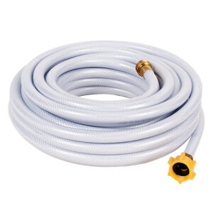 Coiled white garden hose with brass fittings.