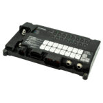 Vehicle electronic control module with connectors and labels.