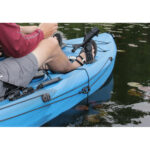 Person kayaking on lake with blue kayak