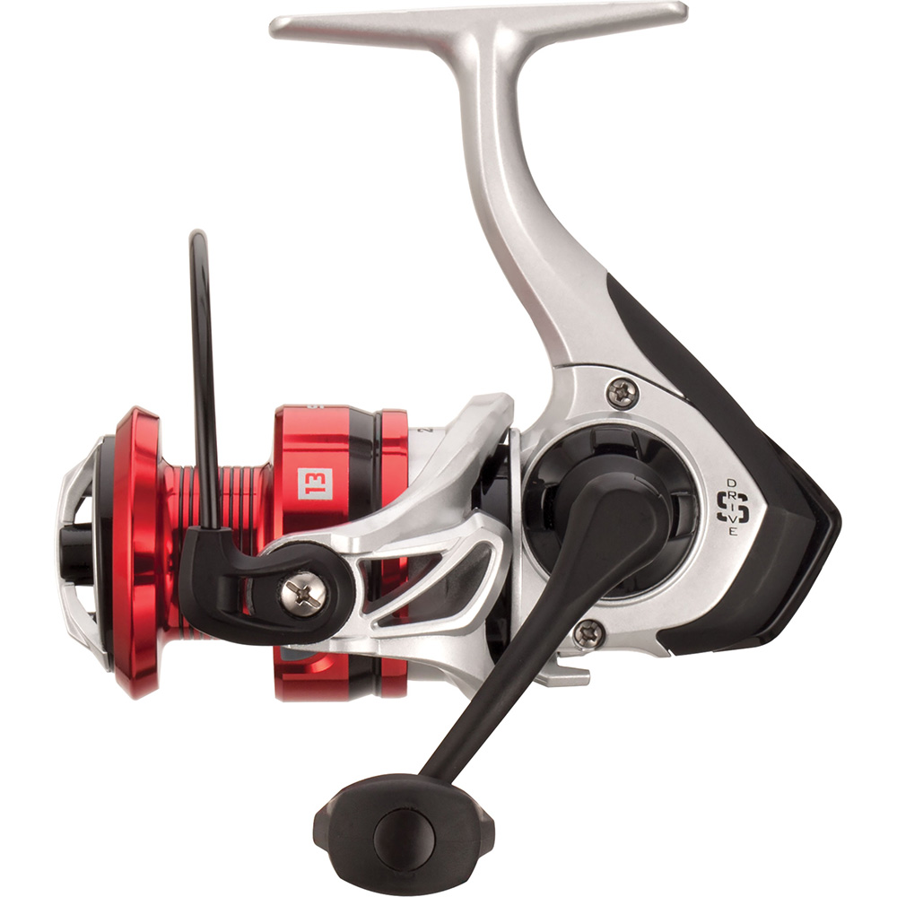 Red and silver fishing reel, side view.