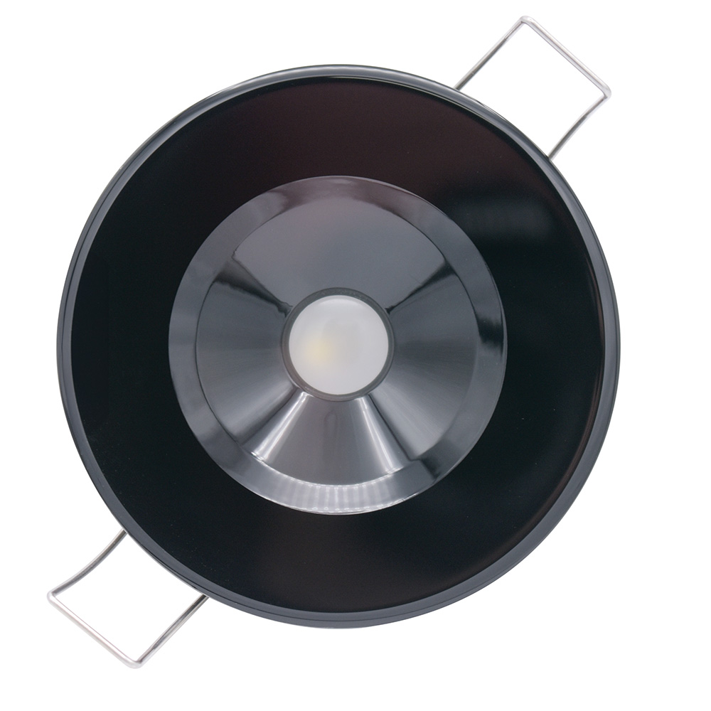 Round overhead view of a modern black lamp.