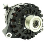 Black automobile alternator with pulley system close-up.