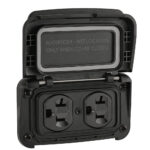 Watertight outdoor electrical outlet with open cover.