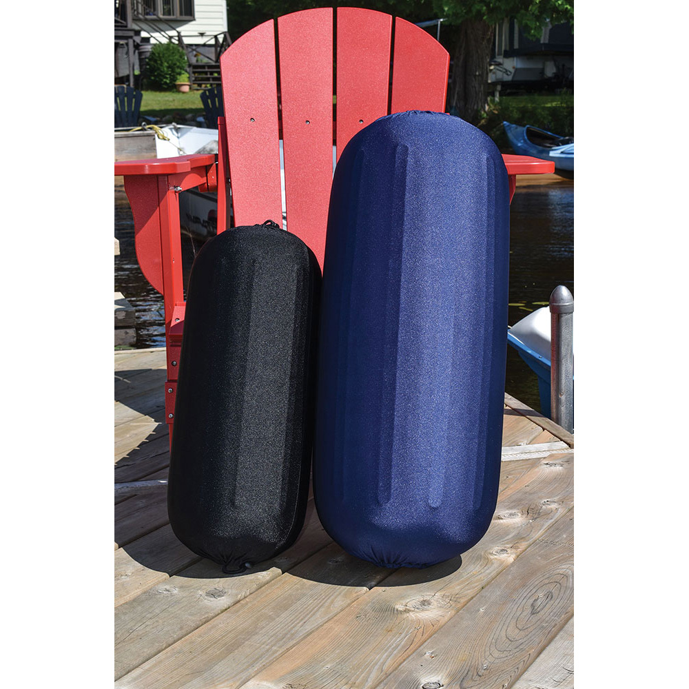 Two boat fenders on wood dock, sunny day.