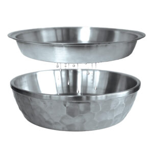 Water dripping between two stainless steel bowls.