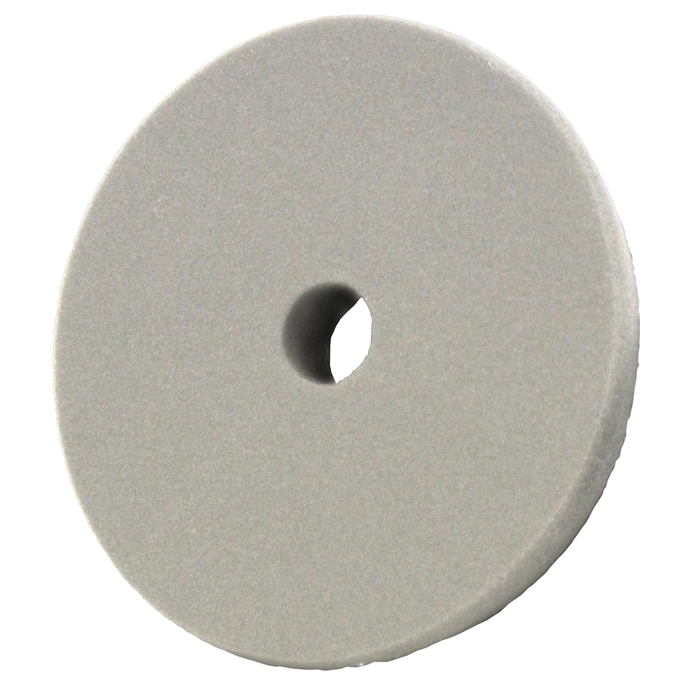 Gray circular buffing pad with center hole.