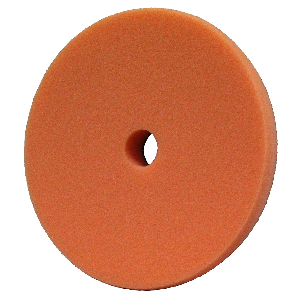 Orange foam polishing pad with center hole.