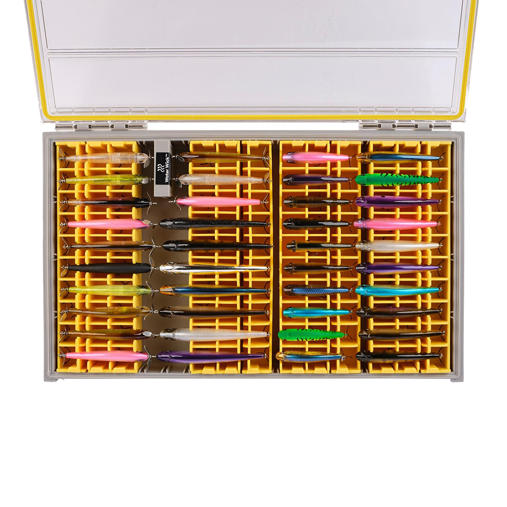 Colorful handmade lures organized in a tackle box.