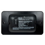 RV propane gas alarm with warning labels.