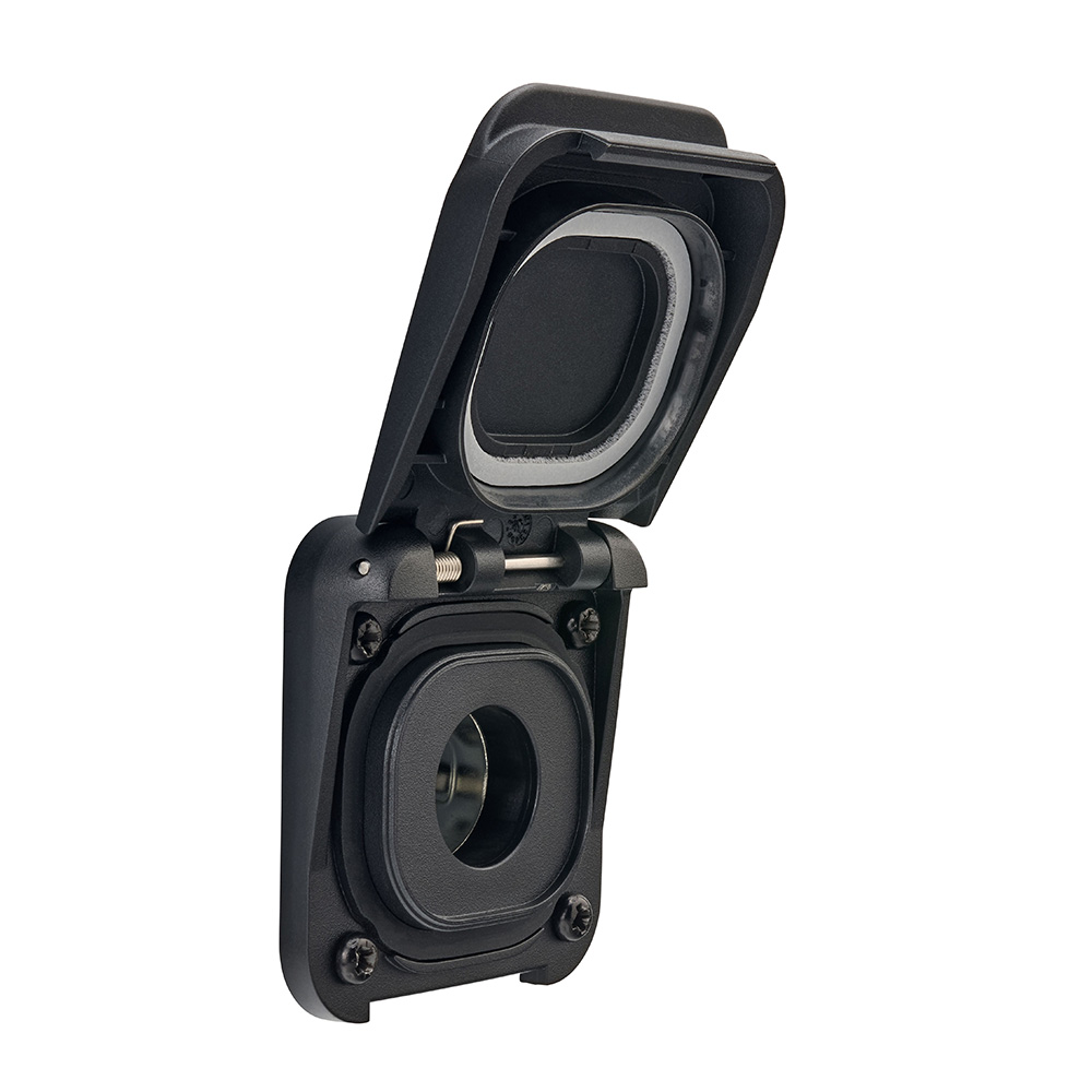 Closed black electrical outlet with protective cover.