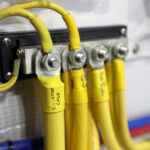 Yellow electrical cables connected to terminal block.
