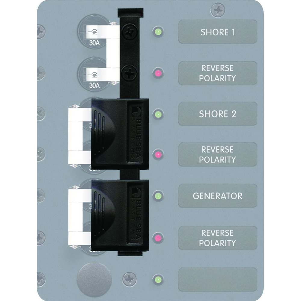Marine electrical panel with circuit breakers and indicators.