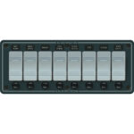 Marine switch panel with eight labeled switches.