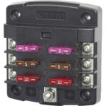 Blue Sea Systems fuse block with multiple fuses.