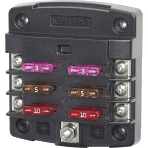 Blue Sea Systems fuse block with multiple fuses.