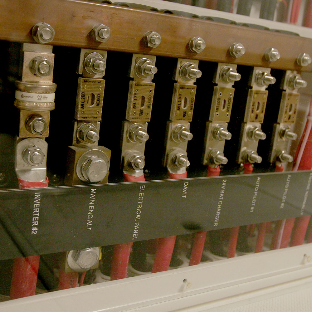 Close-up of electrical panel with labeled fuses.