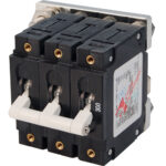 Triple electrical circuit breaker, close-up view.