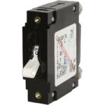 Black electrical circuit breaker with switch and label.