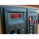 Digital voltmeter reading 13.61 volts on panel.