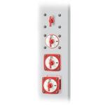 Red industrial power switches in off position.