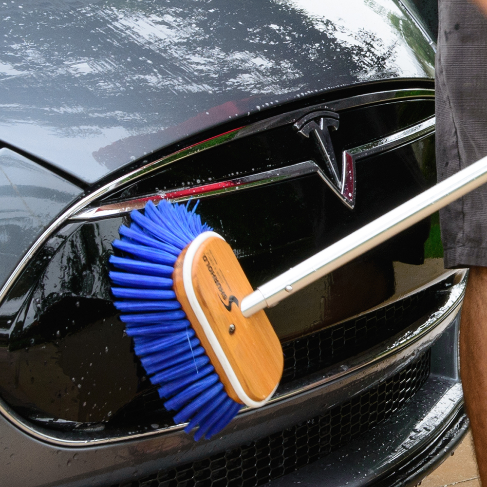 Cleaning car with blue brush