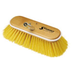 Yellow bristle brush with wooden handle.