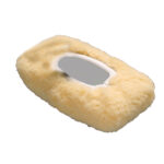 Sheepskin cover for wheelchair armrest, beige color.