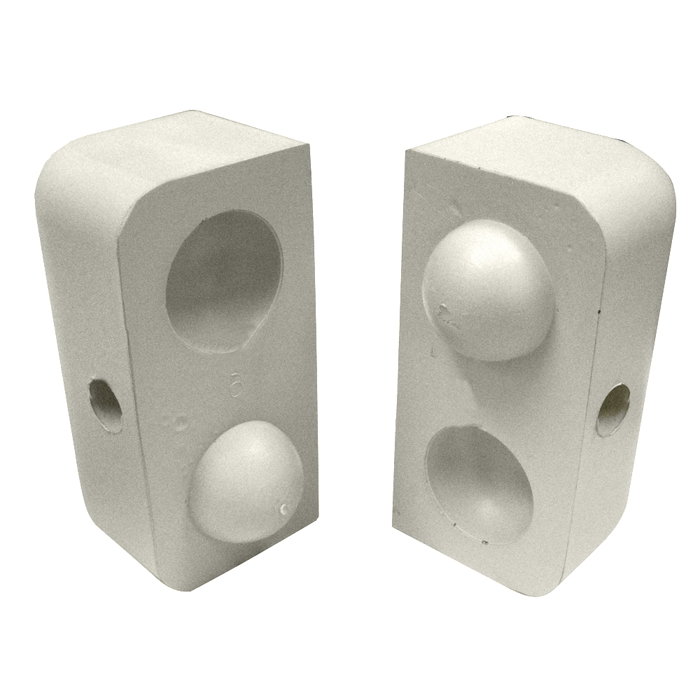 Ceramic blanks with spherical indentations.