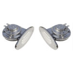 Two chrome metal horns on white background