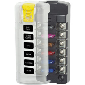 Marine electrical fuse block with labeled circuits.
