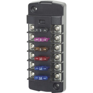 Automotive fuse block with colorful fuses installed.