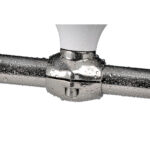 Wet shiny metal pipe connection with water droplets.