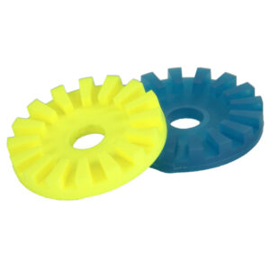Two interlocking rubber gear-like parts in yellow, blue