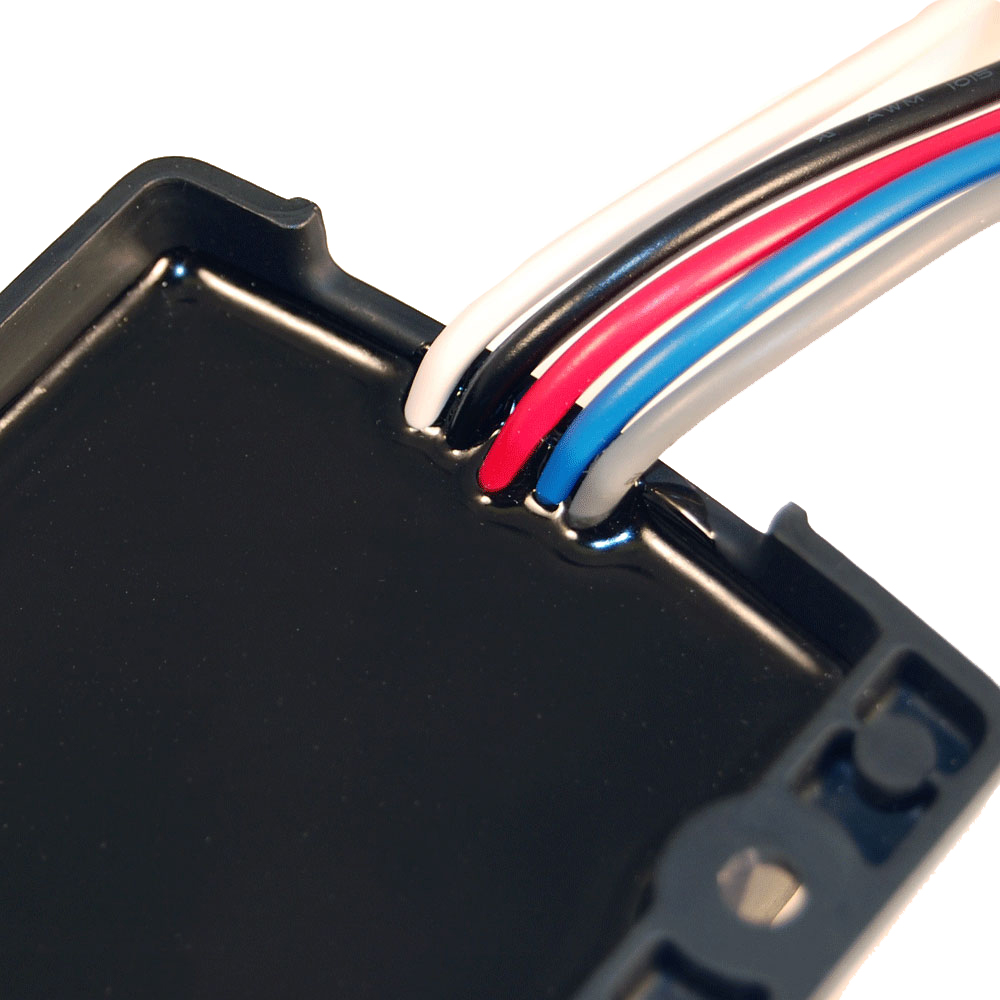 Close-up of wires entering black plastic casing