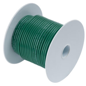 Green electrical wire spool, coiled and ready.
