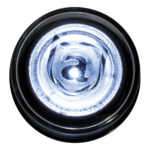 Close-up of translucent bottle cap with letter 'a'.
