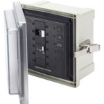 Electrical marine control panel with open cover.
