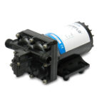 Black water pump with label and mounting bracket.