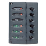 Marine switch panel with labeled switches.