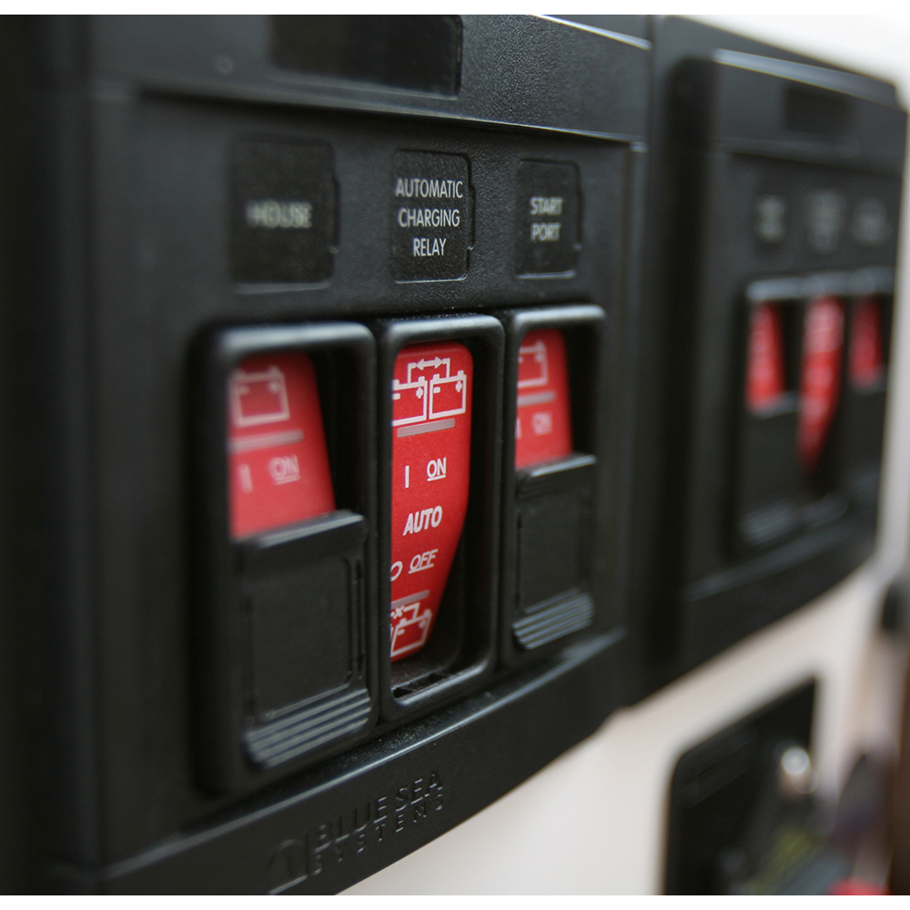 Automatic charging relay panel with switches.