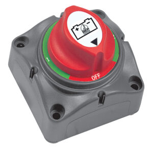 Battery switch with red dial and green indicators.