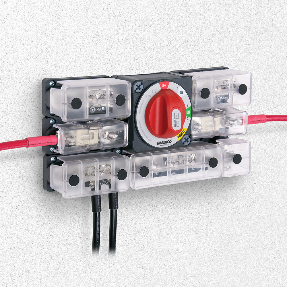 Battery switch with wiring connections on wall.