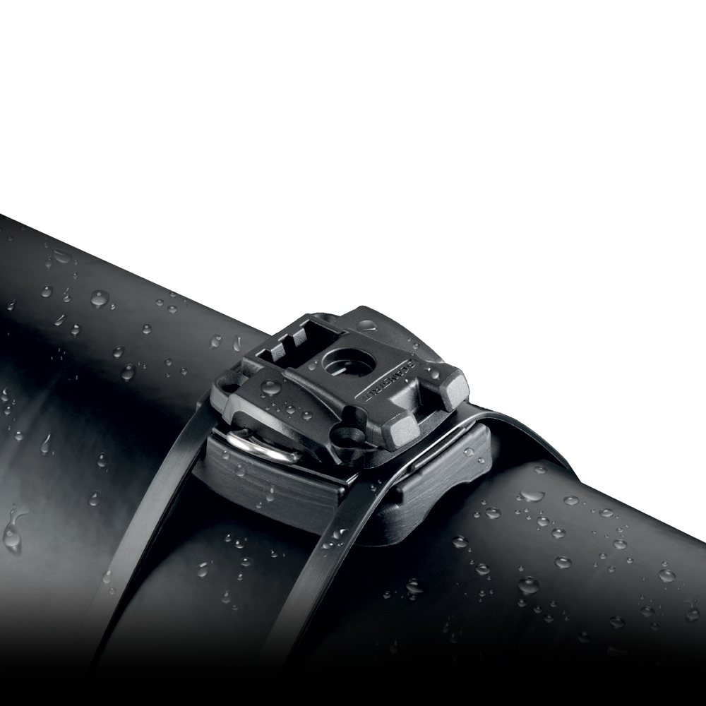 Black pipe with water-resistant clamp, close-up view.