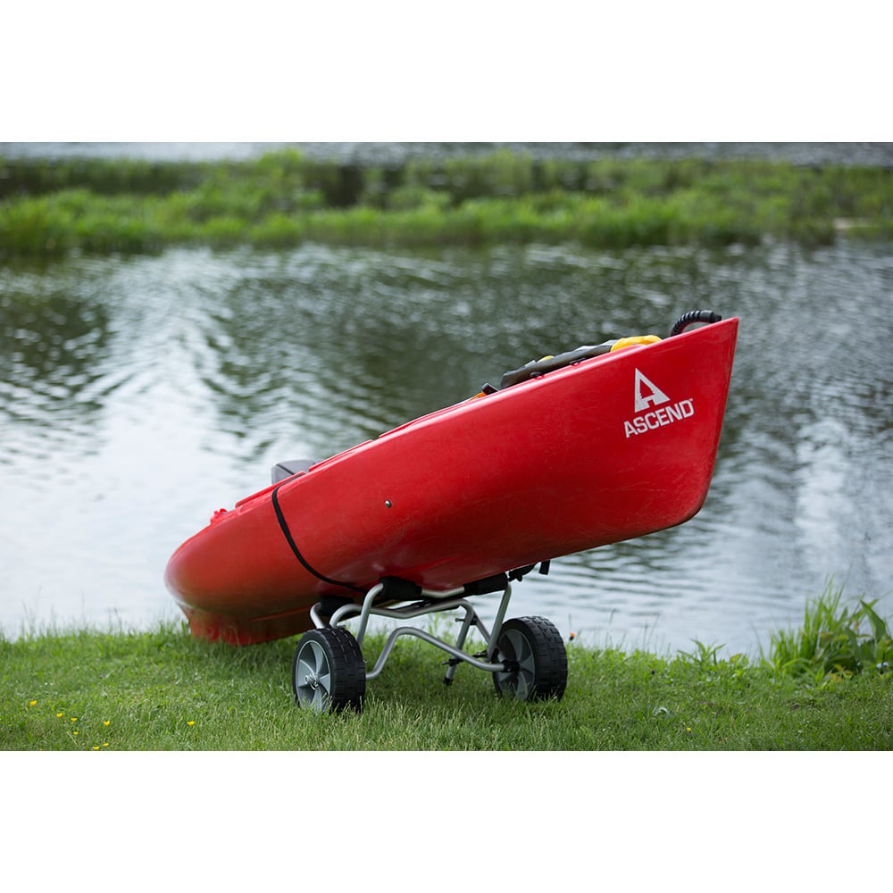 Red kayak with wheels by a lake
