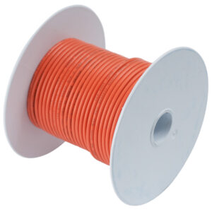 Orange electrical wire spool on white background.